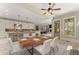 Dining room next to the kitchen features a large wooden table with seating for six at 3405 Camellia Ln, Suwanee, GA 30024