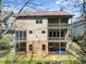 The exterior of the home features dual covered balconies and a fenced yard at 3405 Camellia Ln, Suwanee, GA 30024