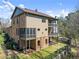 The exterior of the home features dual covered balconies, a fenced yard, and brick accents at 3405 Camellia Ln, Suwanee, GA 30024