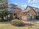Two-story brick home with a stone accent, a two-car garage, and a well-manicured lawn at 3405 Camellia Ln, Suwanee, GA 30024