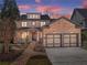 Beautiful two-story brick home with manicured landscaping and a two-car garage at 3405 Camellia Ln, Suwanee, GA 30024