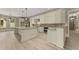 Bright kitchen boasts granite countertops, a kitchen island, and stainless steel appliances at 3405 Camellia Ln, Suwanee, GA 30024