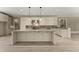 Spacious kitchen featuring granite countertops, an island, and modern appliances at 3405 Camellia Ln, Suwanee, GA 30024