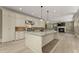 Gourmet kitchen with a stone backsplash, an island, and stainless steel appliances at 3405 Camellia Ln, Suwanee, GA 30024