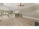 Open-concept kitchen featuring modern cabinets, large island, and hardwood floors at 3405 Camellia Ln, Suwanee, GA 30024