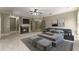 Spacious main bedroom with a fireplace, sitting area, and neutral decor at 3405 Camellia Ln, Suwanee, GA 30024