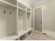 Well-organized mudroom features built-in shelving and a convenient bench at 3405 Camellia Ln, Suwanee, GA 30024