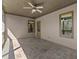 Covered patio with tile flooring, providing a comfortable outdoor living space with plenty of natural light at 3405 Camellia Ln, Suwanee, GA 30024