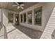 Charming covered patio features a tile floor and a serene backyard view at 3405 Camellia Ln, Suwanee, GA 30024