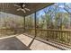 Covered patio with ceiling fan offers a relaxing outdoor living space at 3405 Camellia Ln, Suwanee, GA 30024