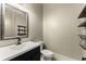Stylish powder room features modern vanity and decorative floating shelves at 3405 Camellia Ln, Suwanee, GA 30024