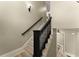 Elegant staircase features dark banister and access to multiple levels at 3405 Camellia Ln, Suwanee, GA 30024
