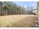 Large backyard with patio and trees at 907 Hindman Pl, Mcdonough, GA 30253