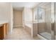 Bright bathroom features a shower, soaking tub, and tile floors at 907 Hindman Pl, Mcdonough, GA 30253