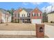 Charming two-story brick and siding home with a well-maintained lawn and an inviting front yard at 907 Hindman Pl, Mcdonough, GA 30253