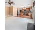 Bright living space featuring plush carpeting, an open floor plan, and a view of the kitchen at 907 Hindman Pl, Mcdonough, GA 30253