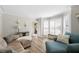 Inviting living room with hardwood floors, large windows with plantation shutters, and neutral paint at 922 Grandview Nw Way, Acworth, GA 30101