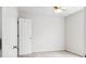 Bright bedroom with a ceiling fan, carpet flooring, and a white door at 3246 Wellington Sw Walk, Atlanta, GA 30331
