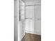 Organized walk-in closet with shelving and hanging rods at 3246 Wellington Sw Walk, Atlanta, GA 30331