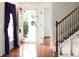 Inviting home foyer featuring hardwood floors, a staircase, and ample natural light at 3246 Wellington Sw Walk, Atlanta, GA 30331