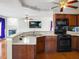Open concept kitchen with modern appliances and countertop space, adjacent to living area at 3246 Wellington Sw Walk, Atlanta, GA 30331