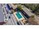 A high definition aerial view of real estate featuring townhomes and a covered community pool at 4282 Roswell Ne Rd # G1, Atlanta, GA 30342