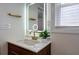 Modern bathroom with a stylish wooden vanity, illuminated mirror, and sleek fixtures, creating a sophisticated space at 4282 Roswell Ne Rd # G1, Atlanta, GA 30342