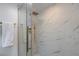 Modern bathroom with gold fixtures, marble tile, and glass shower door at 4282 Roswell Ne Rd # G1, Atlanta, GA 30342