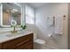 Modern bathroom with a wooden vanity, illuminated mirror, and stylish gold fixtures for a spa-like experience at 4282 Roswell Ne Rd # G1, Atlanta, GA 30342