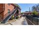 Apartment building exterior with metal stairs and balconies, surrounded by landscaping at 4282 Roswell Ne Rd # G1, Atlanta, GA 30342