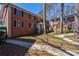 Charming two-story brick building with green door and black shutters at 4282 Roswell Ne Rd # G1, Atlanta, GA 30342