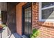 Charming brick exterior with a black front door featuring a window and the number one at 4282 Roswell Ne Rd # G1, Atlanta, GA 30342