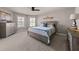 Inviting bedroom featuring two windows, a ceiling fan, and carpeted floors for a comfortable ambiance at 4467 Sterling Pointe Nw Dr, Kennesaw, GA 30152