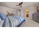 Bedroom featuring light gray walls, a ceiling fan, and wood furnishings at 4467 Sterling Pointe Nw Dr, Kennesaw, GA 30152