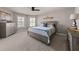 Cozy bedroom with carpet, ceiling fan, natural light, and rustic furnishings at 4467 Sterling Pointe Nw Dr, Kennesaw, GA 30152