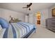 Comfortable bedroom with a ceiling fan and an ensuite bathroom, offering a relaxing retreat at 4467 Sterling Pointe Nw Dr, Kennesaw, GA 30152