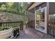 Exterior view of deck with steps leading to lawn and door leading to porch and seating at 4467 Sterling Pointe Nw Dr, Kennesaw, GA 30152