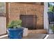 Close up of outdoor brick fireplace and comfortable seating on a screened porch at 4467 Sterling Pointe Nw Dr, Kennesaw, GA 30152