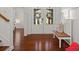 Bright foyer features wood floors, white paneled walls, and a wooden bench to greet visitors at 4467 Sterling Pointe Nw Dr, Kennesaw, GA 30152