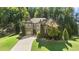 Beautiful two-story home with manicured lawn, stone accents, and a welcoming front entrance at 4467 Sterling Pointe Nw Dr, Kennesaw, GA 30152