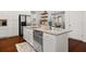 Bright kitchen with white cabinetry, stainless steel appliances, and granite countertops at 4467 Sterling Pointe Nw Dr, Kennesaw, GA 30152