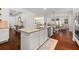 Spacious kitchen island with stainless steel appliances and dark hardwood flooring at 4467 Sterling Pointe Nw Dr, Kennesaw, GA 30152