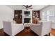 Inviting living room with fireplace, built-in bookshelves, and comfortable seating at 4467 Sterling Pointe Nw Dr, Kennesaw, GA 30152
