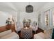 Living room featuring hardwood floors, white walls, and a decorative ottoman at 4467 Sterling Pointe Nw Dr, Kennesaw, GA 30152
