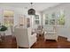 Cozy sunroom with white walls, hardwood floors, and lots of natural light at 4467 Sterling Pointe Nw Dr, Kennesaw, GA 30152