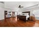 Spacious main bedroom with hardwood floors, fireplace, sitting area, and coffered ceiling at 4467 Sterling Pointe Nw Dr, Kennesaw, GA 30152