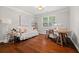 Bright office with hardwood floors, large window, and daybed at 4467 Sterling Pointe Nw Dr, Kennesaw, GA 30152
