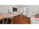 Home office with hardwood floors, natural light, and two desks at 4467 Sterling Pointe Nw Dr, Kennesaw, GA 30152