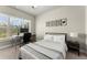 Comfortable bedroom with a desk area illuminated by natural light from a large window and stylish decorations at 226 Chastain Preserve Ne Ln, Atlanta, GA 30342