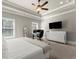 Bedroom with a ceiling fan, windows, desk, dresser, and TV offering great natural light and lots of space at 226 Chastain Preserve Ne Ln, Atlanta, GA 30342